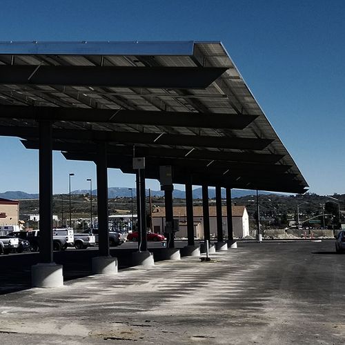 Commercial solar carport structure providing shade to parking area